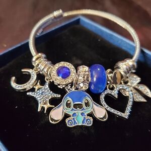 Silver Stitch Charm Bracelet with Heart, Stars, And Bow